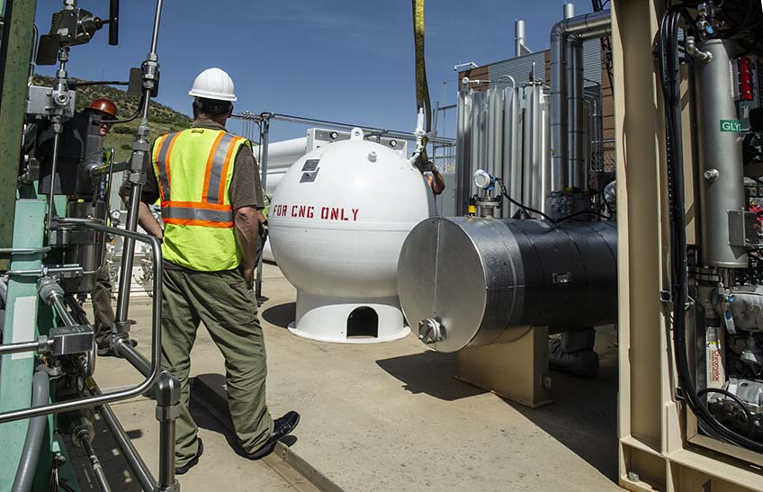 June 27, 2019 - Crews crane a natural gas storage vessel rated to 5000 PSIG into place in the bioreactor outside the Energy Systems Integration Facility (ESIF).  It will store renewable methane production from the SoCalGas bioreactor which converts carbon dioxide (CO2) + water (H2) into methane (CH4), water, and heat. (Photo by Dennis Schroeder / NREL)
